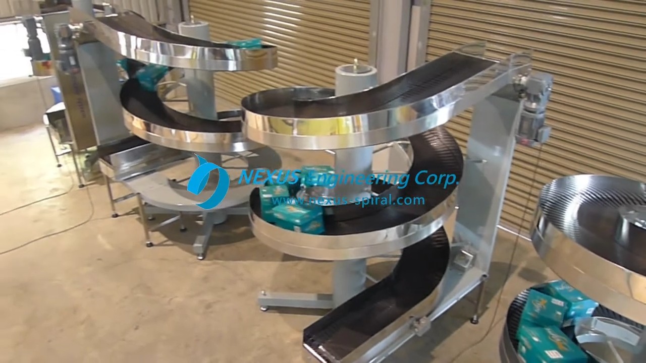 Stainless steel spiral conveyors with connecting conveyors in the NEXUS factory.