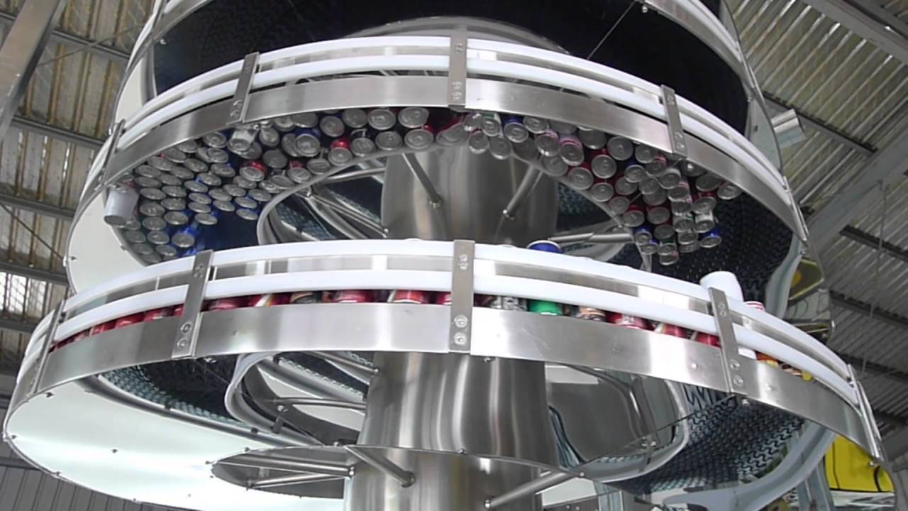 Steel cans packed across the track of a stainless steel spiral conveyor.