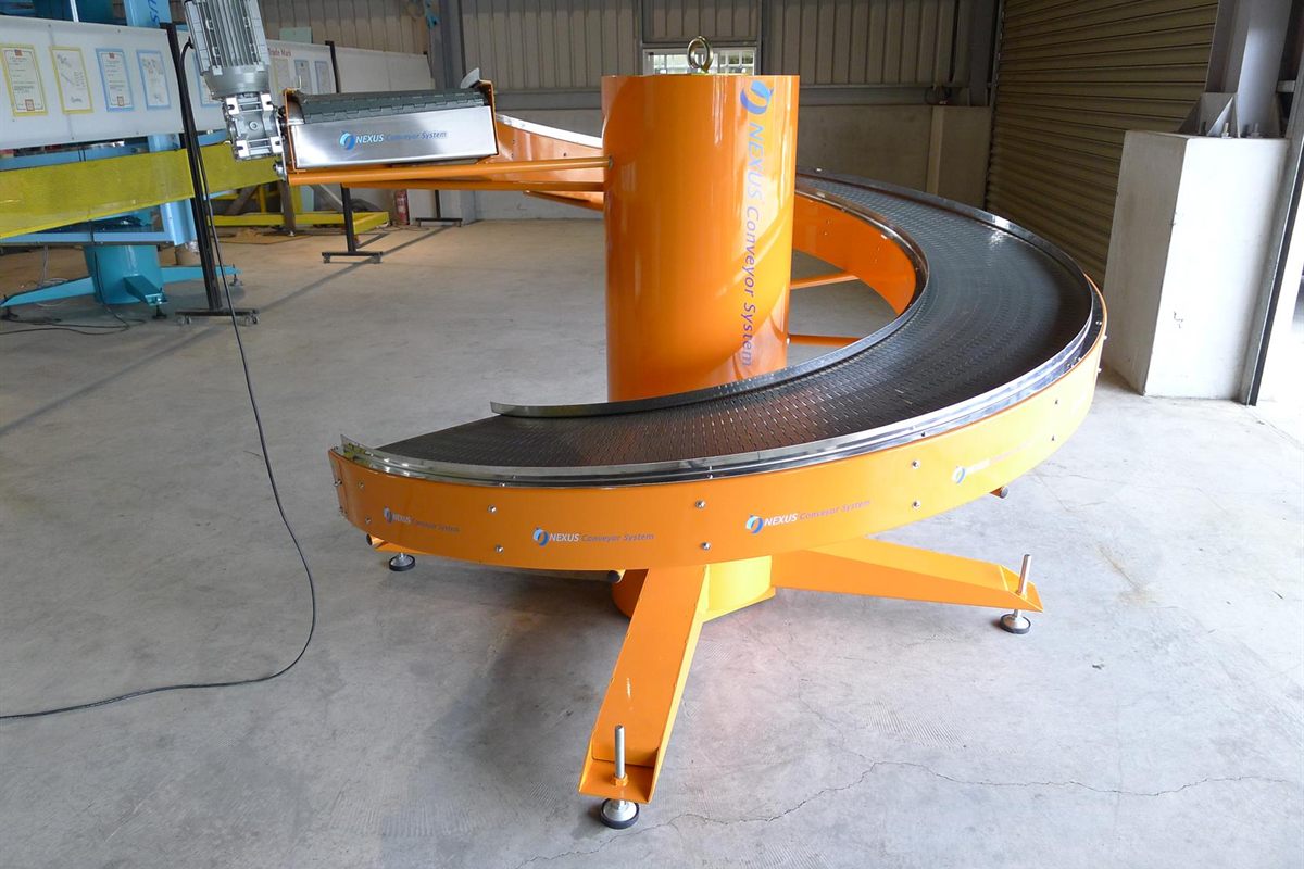 A NEXUS spiral curve conveyor in its complete form, a single continuous curved run with one drive unit.